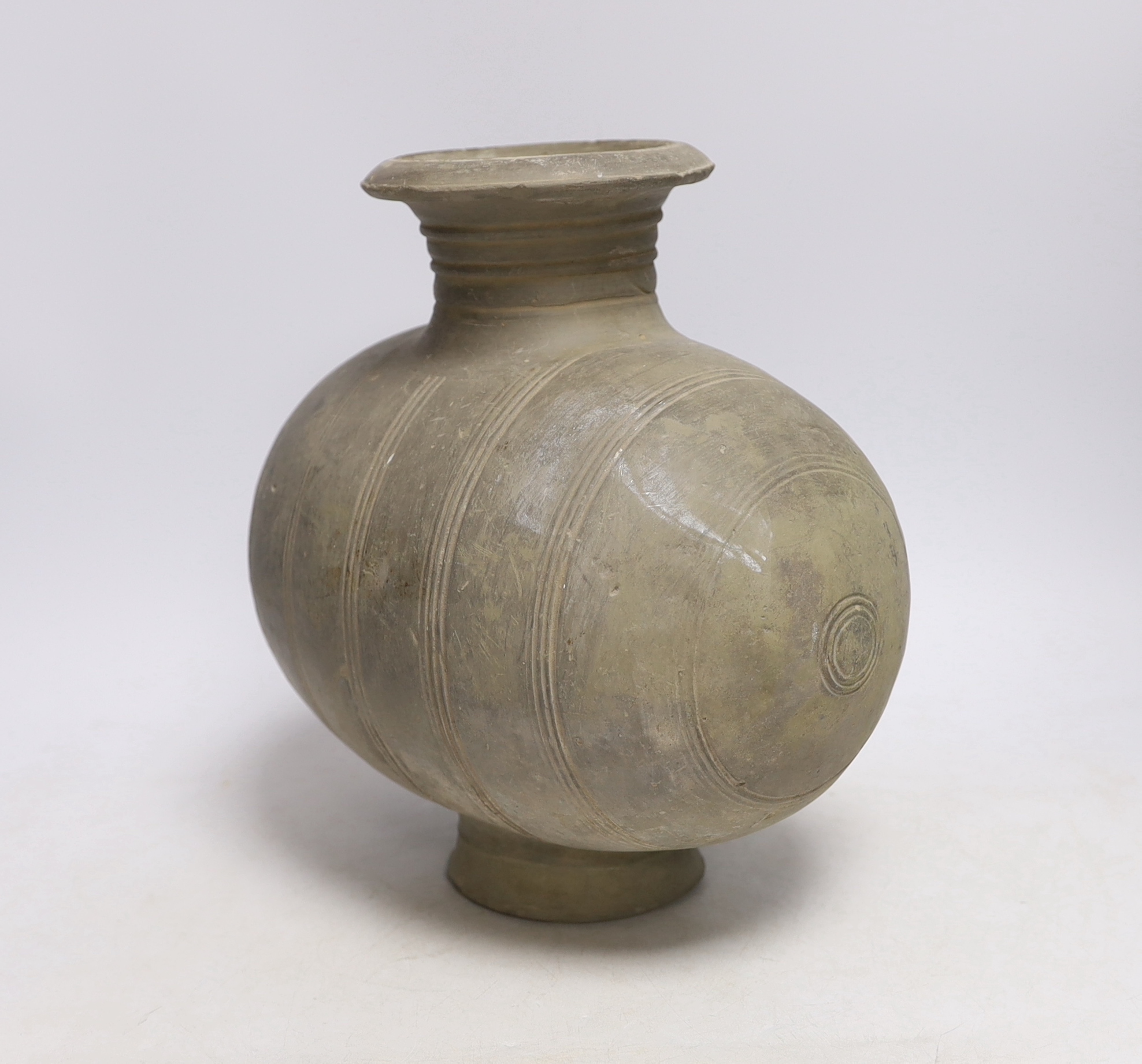 A Chinese grey pottery 'cocoon' jar, Han dynasty, 27cm